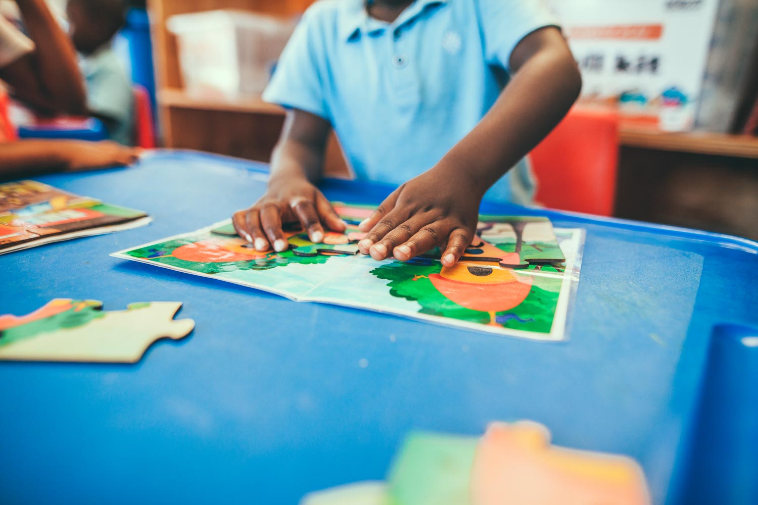 Kids in class using educational toys.