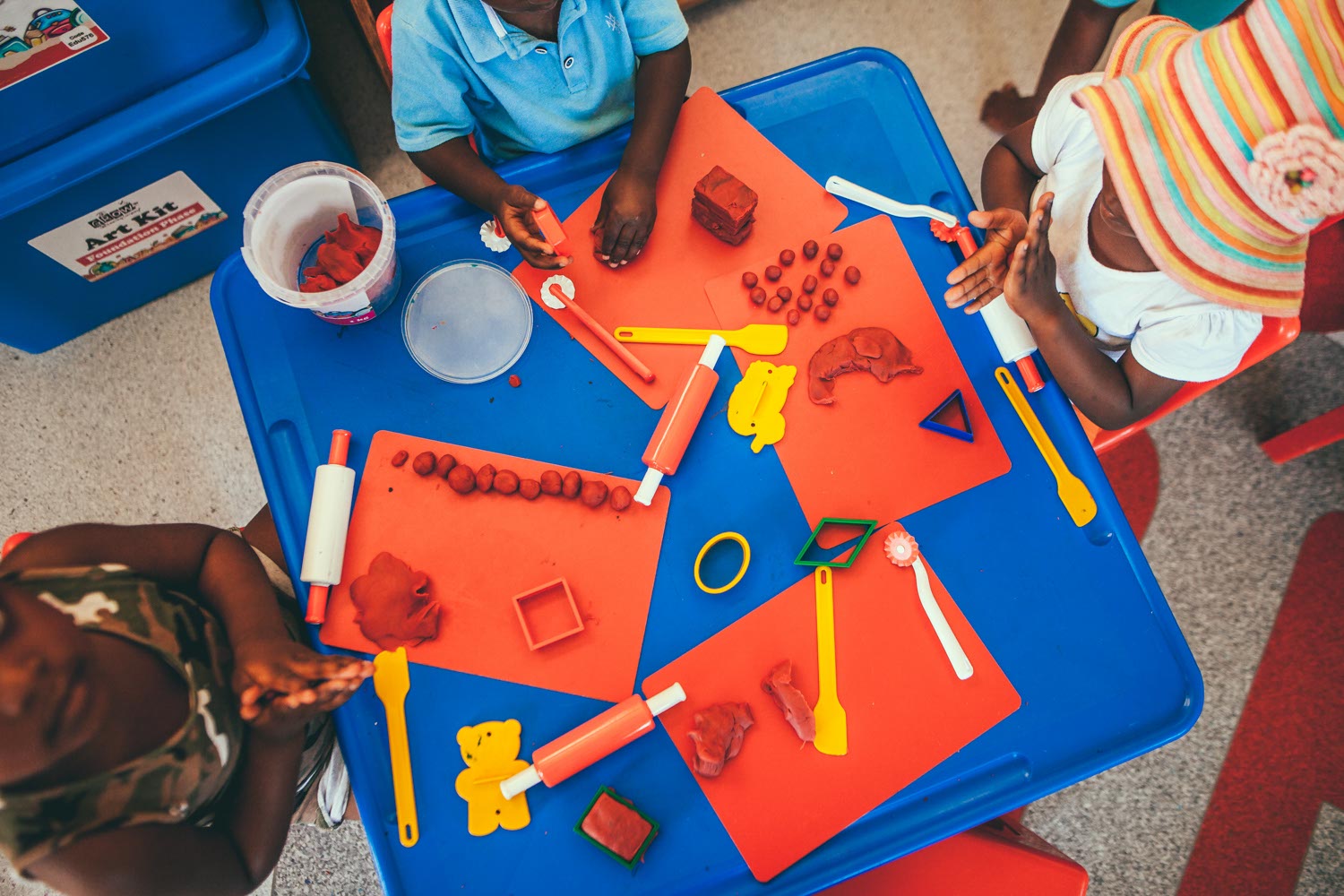 Kids in class using educational toys.