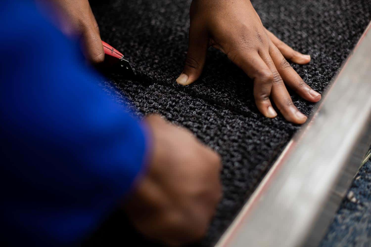Learning carpet tile installation.