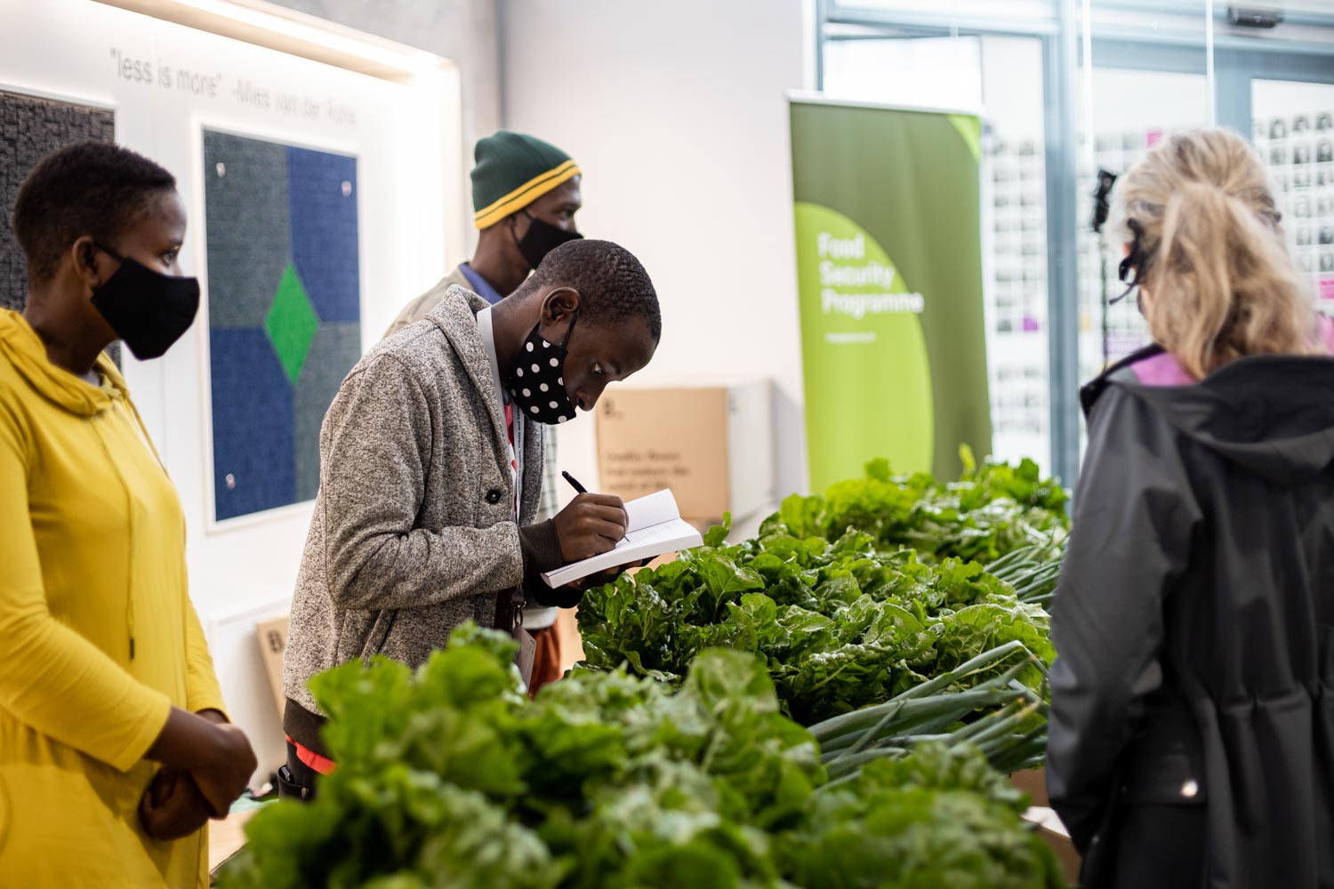 Food Security Programme farmers selling produce at a market day.